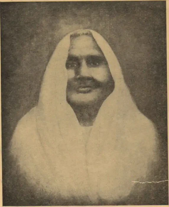 Archival halftone photograph of Matangini Hazra, an elderly woman with her sari drawn over her head, looking directly at the camera.
